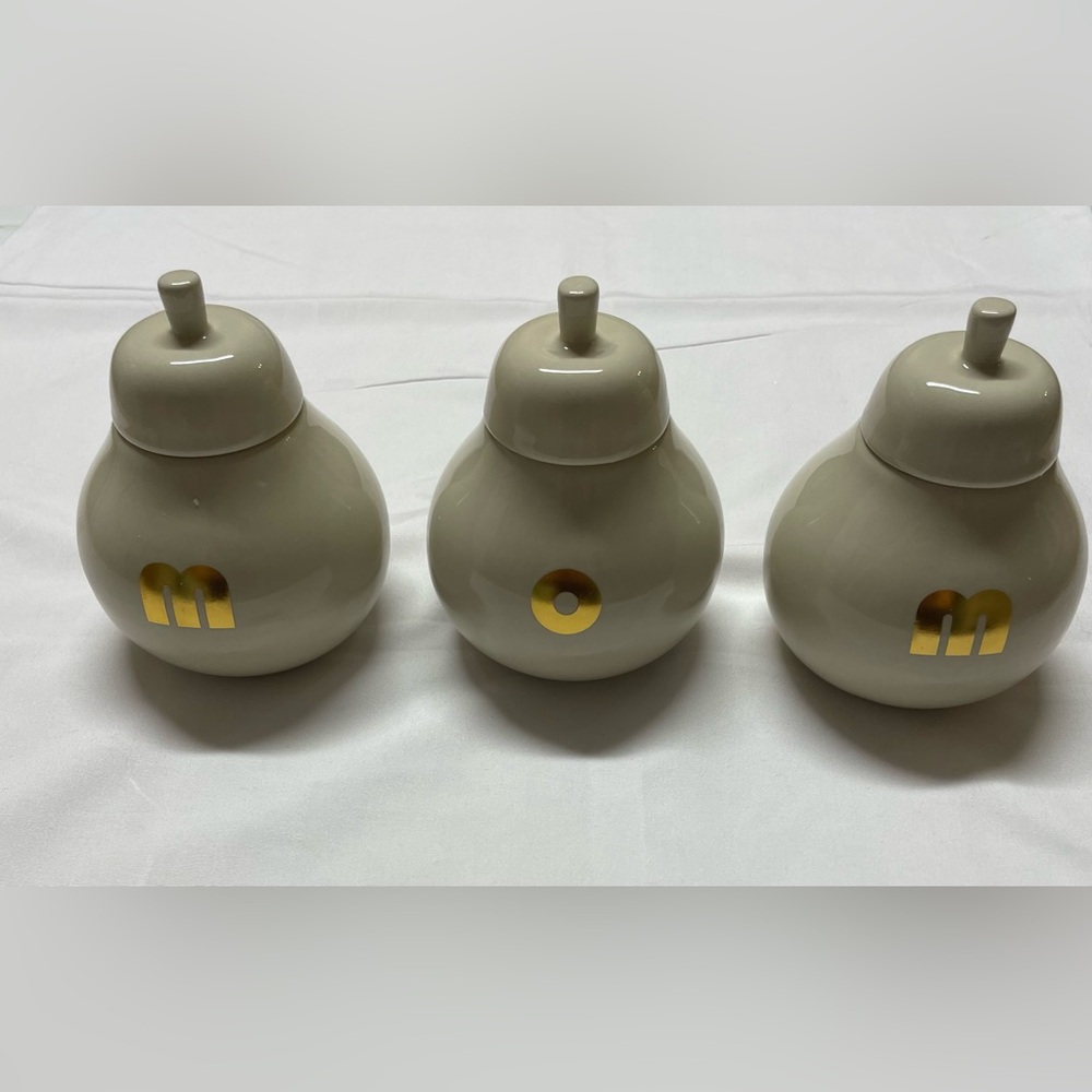 Elegant Beige Ceramic Jars with Gold Accents